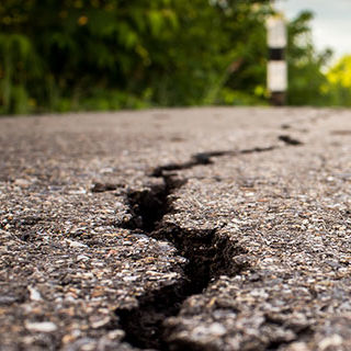 Inszone Insurance Earthquake Insurance Page Banner - Cracked Road
