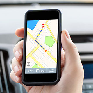 Driver Using Navigation Map on Mobile Device - Lead Image for Taxi & Ride Share Services Page