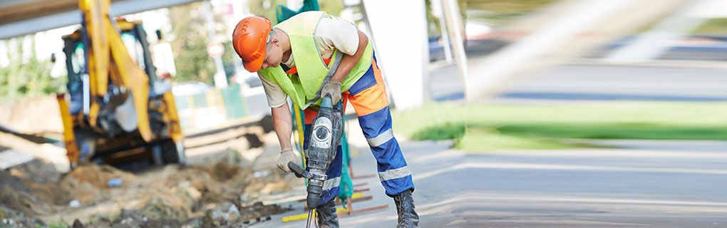 Male Worker Using a Jack Hammer Drill - Lead Image for Street and Road Construction Page