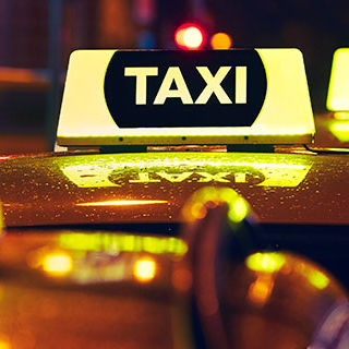 Three Taxis Lining Up - Lead Image for Taxi & Ride Share Services Page