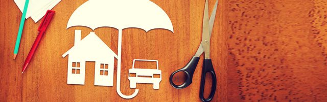 Inszone Insurance Umbrella Insurance Page Banner - Scissors, Pens and Cut Outs on Table