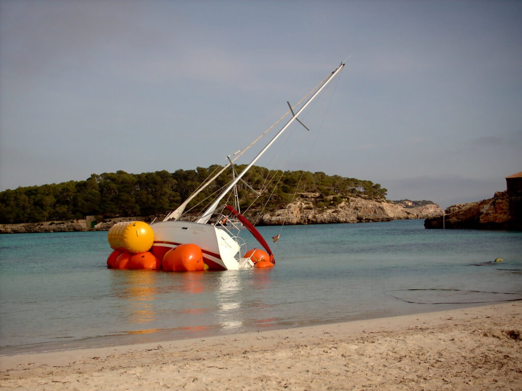 Boat damaged in storm showing why insurance is essential