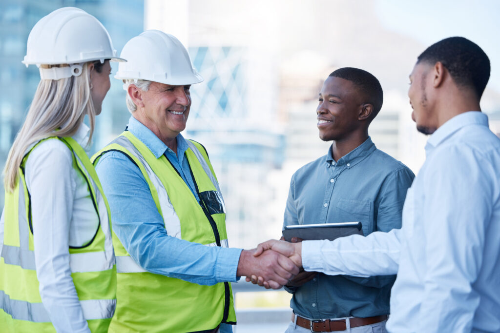 Contractor discussing bonding capacity strategies with a bond specialist in a professional office setting.