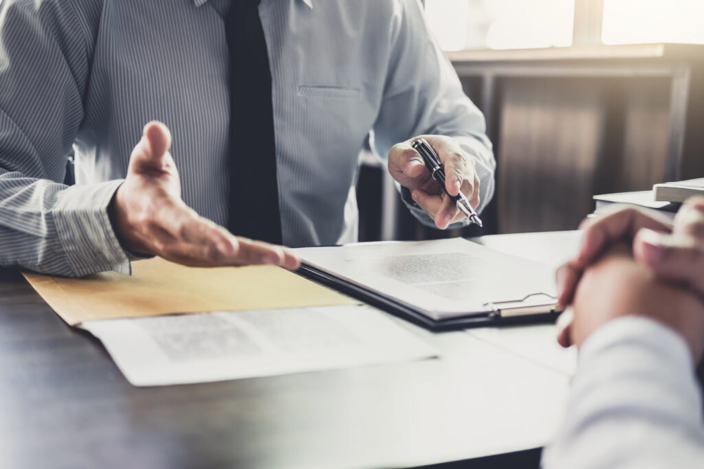 Illustration of an insurance agent discussing admitted insurance benefits with a customer.